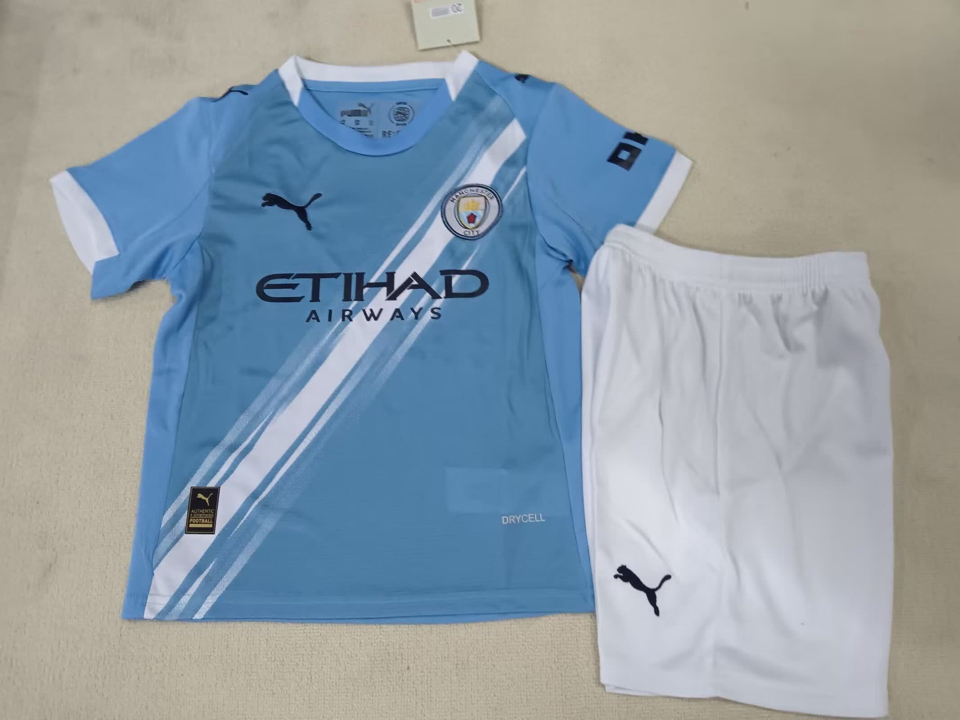 25/26 Kids Manchester City home size: 16-28